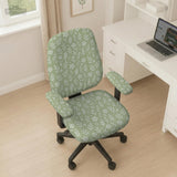 Sage green desk chair cover with a small floral and leaf print shown on an office chair.