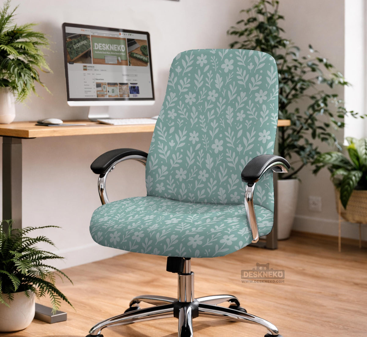Mint and white botanical desk chair cover with a floral leaf pattern shown on an office chair.