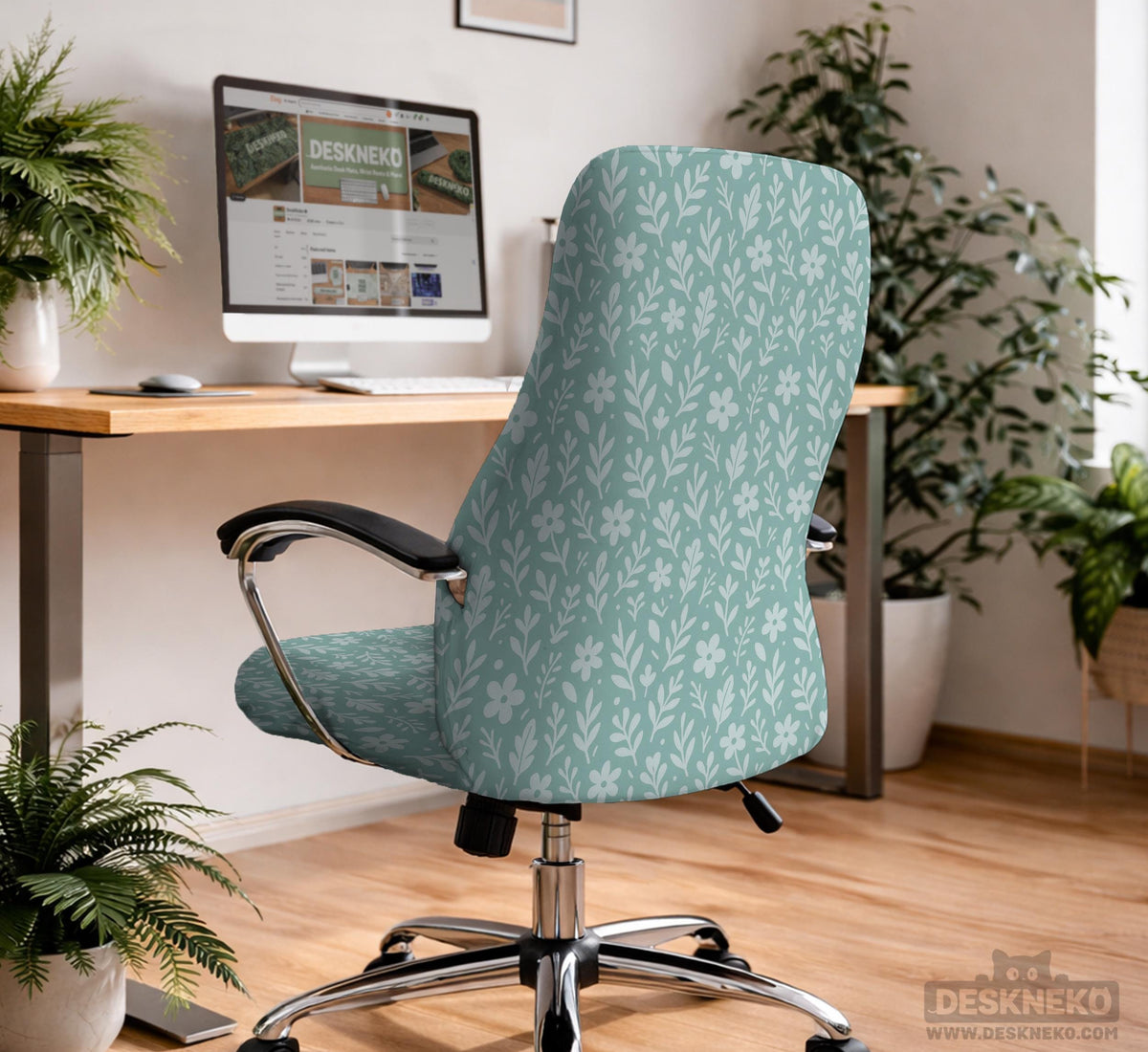 Sage and aqua green floral chair cover shown on a gaming chair with matching armrest covers.