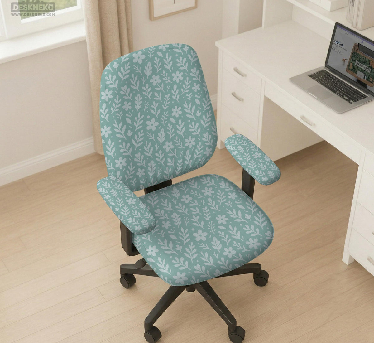 Sage and aqua green floral chair cover shown on a gaming chair with matching armrest covers.