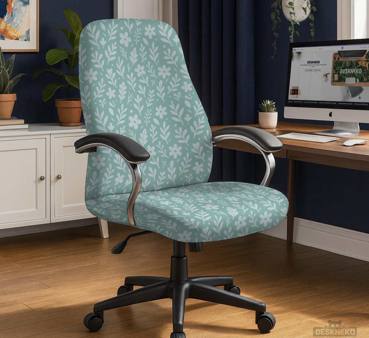 Mint and white botanical desk chair cover with a floral leaf pattern shown on an office chair.