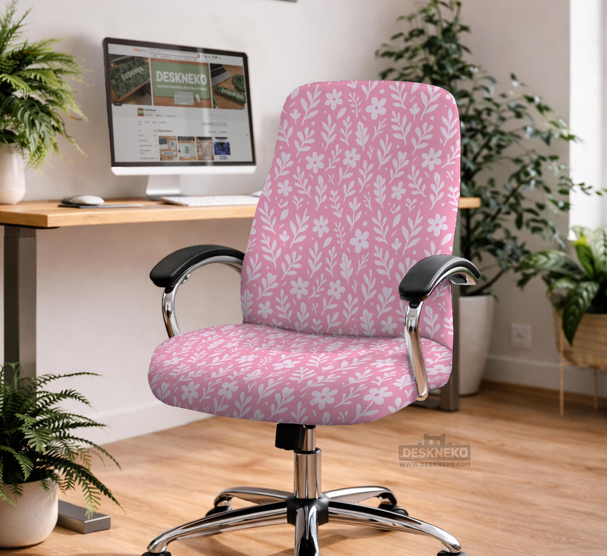 Blush pink chair cover with a small botanical floral pattern shown on an office chair.