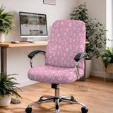 Soft pink floral chair cover shown on a gaming chair with a high back and armrests.