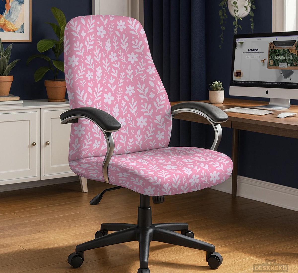 Blush pink chair cover with a small botanical floral pattern shown on an office chair.