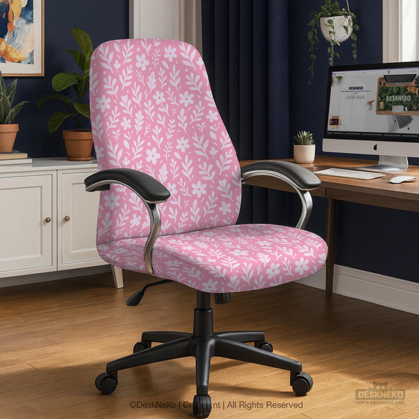 Blush pink chair cover with a small botanical floral pattern shown on an office chair.