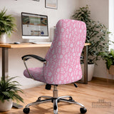 Soft pink floral chair cover shown on a gaming chair with a high back and armrests.