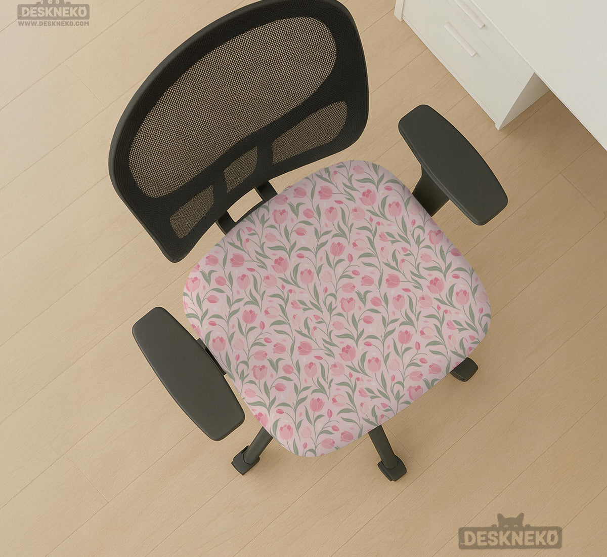 Pink floral stretch chair cover with a tulip pattern shown on a high-back gaming or office chair.