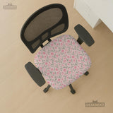 Pink floral stretch chair cover with a tulip pattern shown on a high-back gaming or office chair.