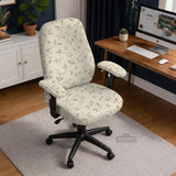 Cream floral chair covers with muted sage leaves and fine vine details on an ivory background, shown as multiple slipcover options for chair backs, seats, and armrests.