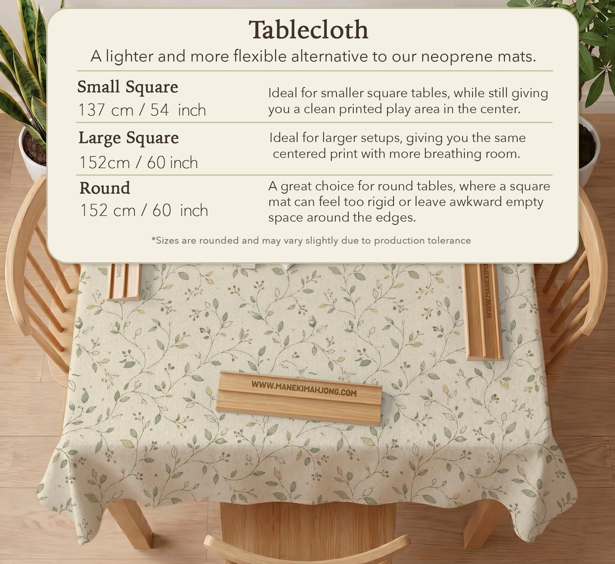 Sage green botanical mahjong mat with a cream background, trailing vines, and muted leaf designs.
