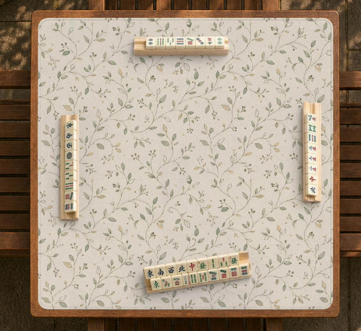Sage green mahjong mat with vine and botanical artwork in cream neutral tones, shown in a cottagecore style with a tablecloth-style format.