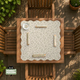 Sage green botanical mahjong mat with a cream background, trailing vines, and muted leaf designs.