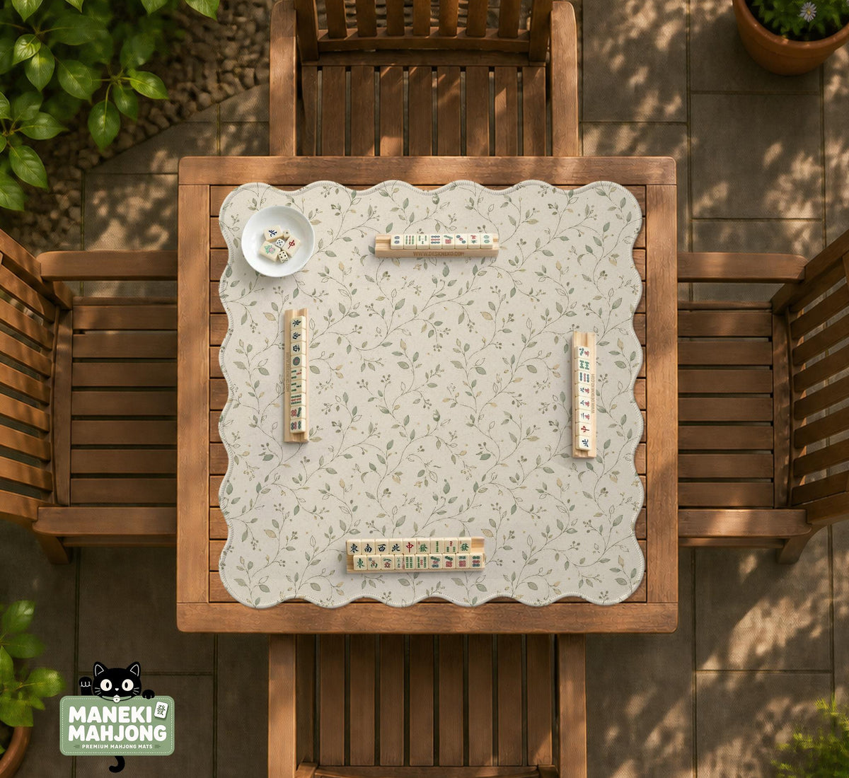 Cream square mahjong mat with a sage vine and leaf botanical pattern and scalloped edges.