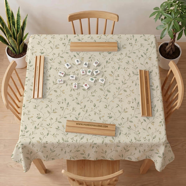 Sage green mahjong mat with vine and botanical artwork in cream neutral tones, shown in a cottagecore style with a tablecloth-style format.