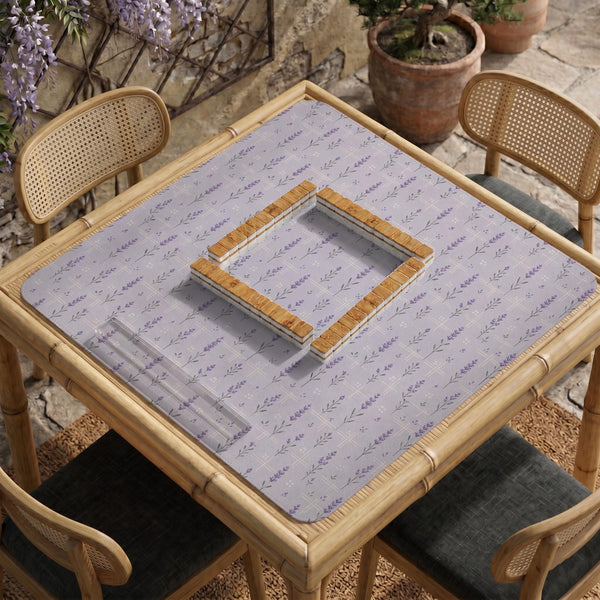 Lavender mahjong mat with a pale purple background, small botanical sprigs, and fine grid lines.