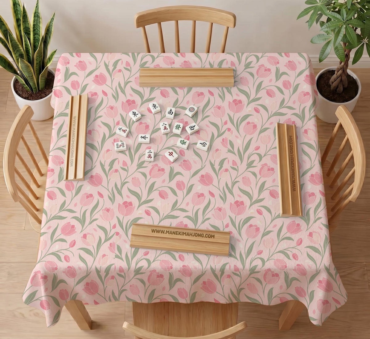 Pink mahjong mat with a tulip floral pattern in blush and sage tones and a scalloped edge.