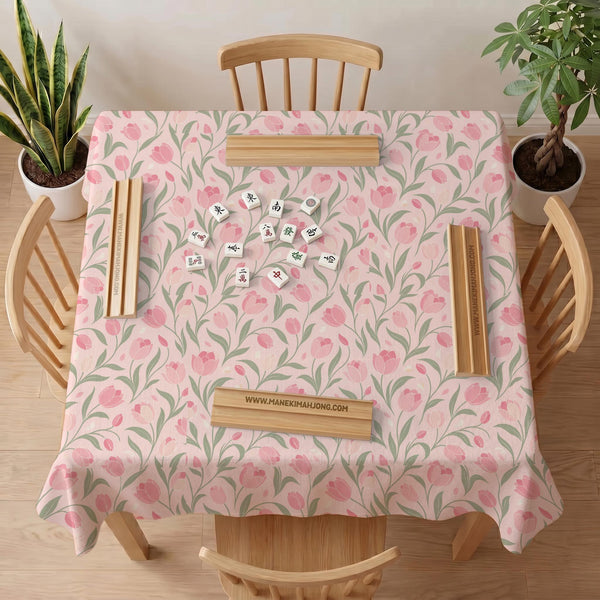 Pink mahjong mat with a botanical tulip floral pattern in blush tones, shown in a tablecloth-style square layout.