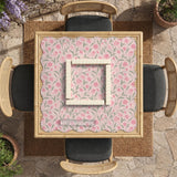 A pink mahjong mat with tulip flowers, sage leaves, and a light pastel background.