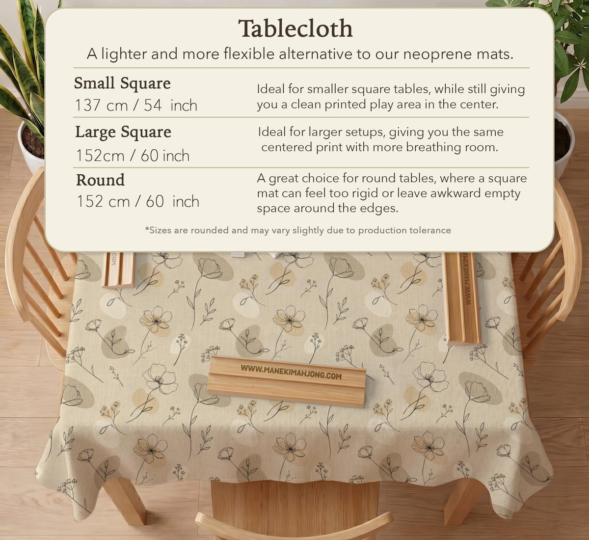 Neutral floral mahjong mat with delicate botanical line art and a scalloped edge on a cream background.