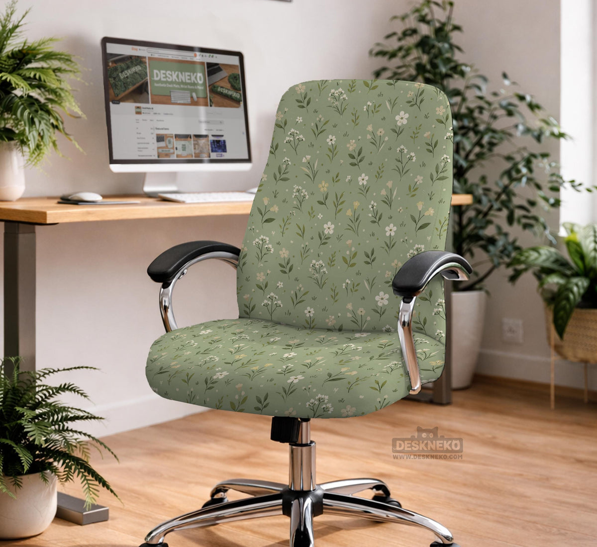 Sage green chair cover with a small floral print shown on a desk chair with a high back.