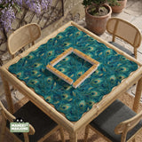 A teal mahjong mat with a peacock feather pattern and scalloped edges.