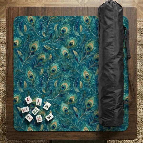 A teal mahjong mat with a peacock feather pattern and scalloped edges.