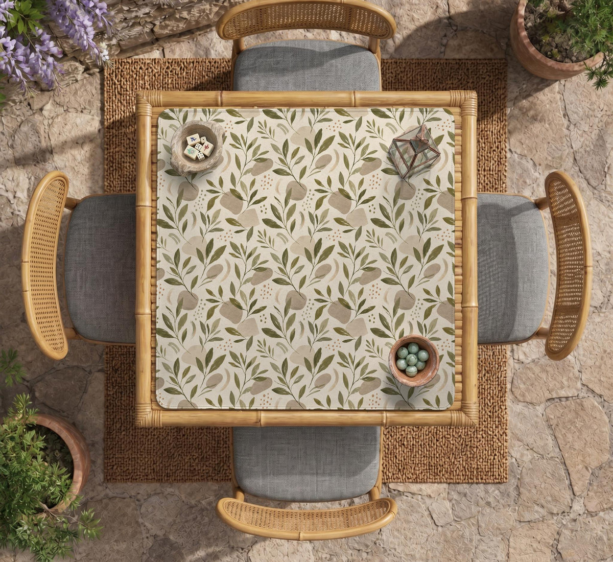 Green botanical mahjong mat with sage leaf and floral design and a scalloped edge.